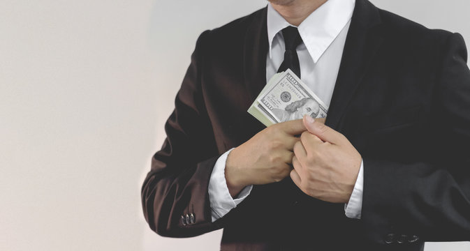 Businessman In Black Costume Put Or Take Out Money In Pocket, Close Up