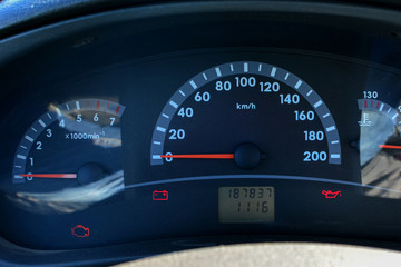 Fototapeta premium Car speedometer and tachometer close-up. Car abstract background for design and design.
