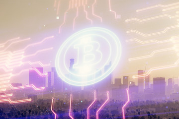 Double exposure of crypto currency theme hologram drawing and city veiw background. Concept of blockchain and bitcoin.