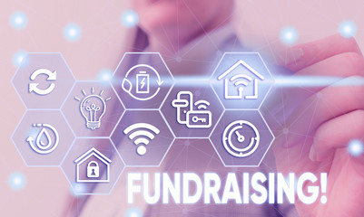 Conceptual hand writing showing Fundraising. Concept meaning seeking to generate financial support...
