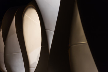 Background and texture of an abstract shape  of a fragment of a modern architecture in  lights and shadows