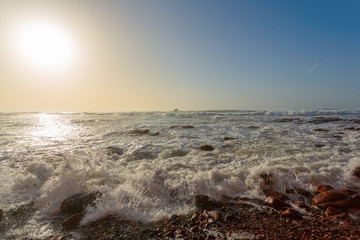 Red archs on atlantic ocean coast. Marocco