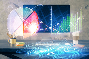 Double exposure of graph and financial info and work space with computer background. Concept of...