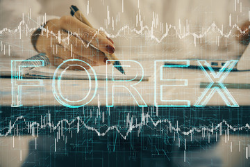 Double exposure of woman's hands making notes with forex graph hologram. Concept technical analysis.