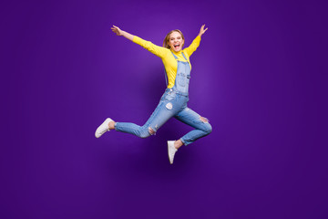 Fototapeta na wymiar Full size photo of lovely youth raising her hands screaming isolated over purple violet background
