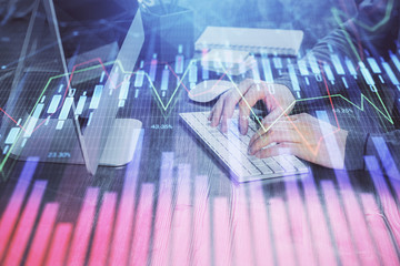 Double exposure of financial graph with man works in office on background. Concept of analysis.
