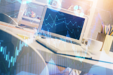 Stock market graph and table with computer background. Multi exposure. Concept of financial analysis.