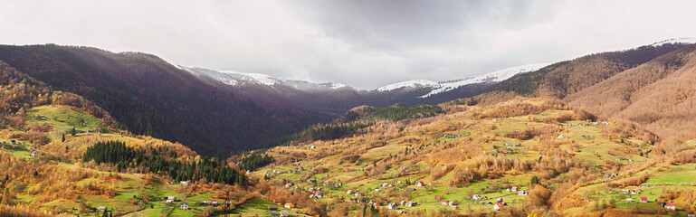 Carpatian village at mountains at the sunny day