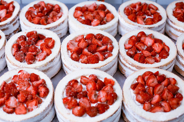 Confectionery production for the production of cakes with fresh strawberries and syrup. Red cake with fresh berry, desert, background