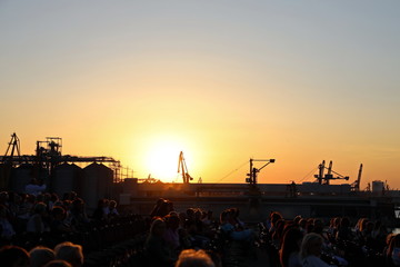 Sunset in the port of Odessa. Night views of piers and ships. Summer 2019.