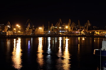 Sunset in the port of Odessa. Night views of piers and ships. Summer 2019.