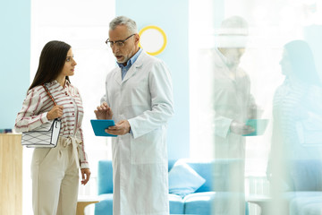 Fototapeta premium Serious mature man consulting his new patient