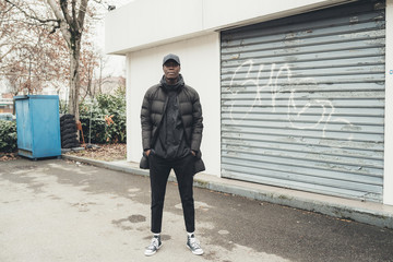 young african man standing in the street