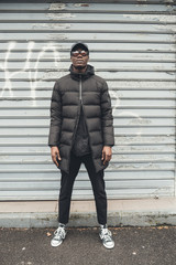 portrait of young african man standing in the street