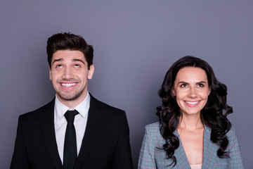 Close-up portrait of his he her she nice attractive stylish cheerful cheery funny dreamy partners experts company director founder looking up isolated over gray violet purple background