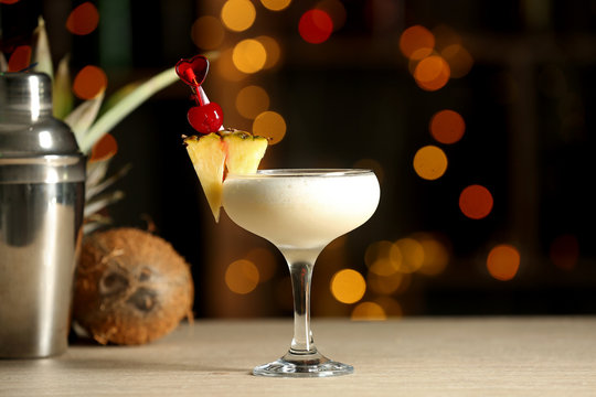 Glass Of Tasty Pina Colada Cocktail On Table In Bar