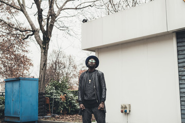 young bearded african man outdoors posing