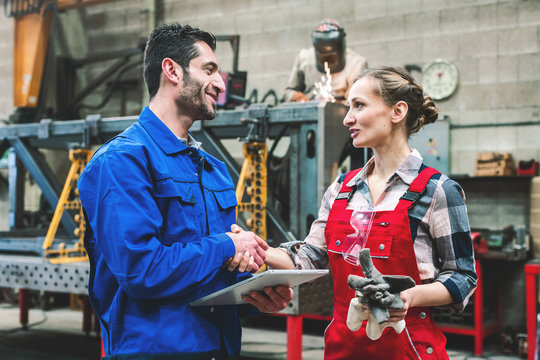 Worker in factory or workshop discussing project