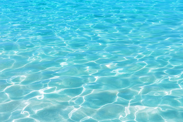 Obraz na płótnie Canvas Shining blue water ripple background.