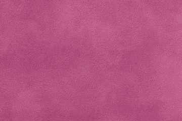 Dark red matt suede fabric closeup. Velvet texture.