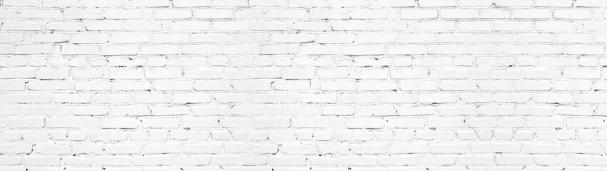 Whitewashed brick wall panoramic texture. White painted old brickwork panorama. Widescreen light background