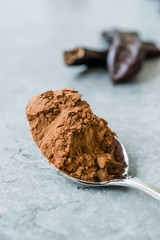 Carob Powder and Pods Ready to Use in Spoon