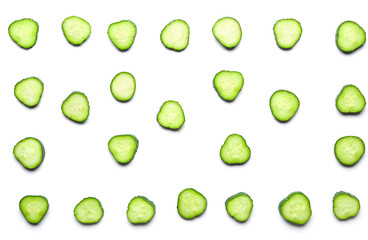 Many slices of cucumber on white background