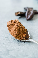 Carob Powder and Pods Ready to Use in Spoon