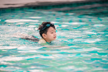 Fun boy in swimming pool