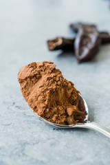 Carob Powder and Pods Ready to Use in Spoon