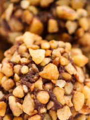 Macro shot of chocolate truffle with nuts topping