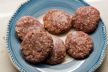 Turkish Raw Meatballs Kofte or Kofta made with Minced Meat in Plate.