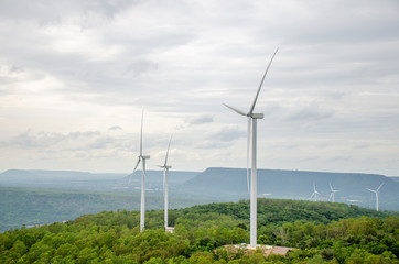 Aerial view of Wind turbine with hybrid tower on agricultural fields. Renewable energy production for green ecological world at Yai-Tiang hill,Thailand 