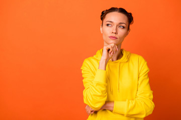 Portrait of concentrated youth touching her chin with fingers looking having thoughts isolated over...