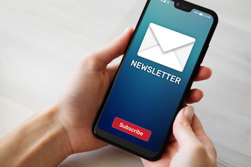 Newsletter subscription button on mobile phone screen. Business marketing concept.