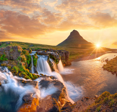 Beautiful landscape with sunrise on Kirkjufellsfoss waterfall and Kirkjufell mountain, Iceland, Europe. © Lukas Gojda