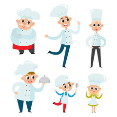 Chefs in uniform in restaurant kitchen cooking isolated on white