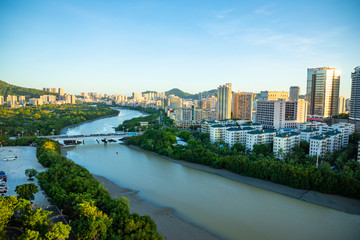 Aerial view of Sanya city with river at sunset light, Hainan province, China