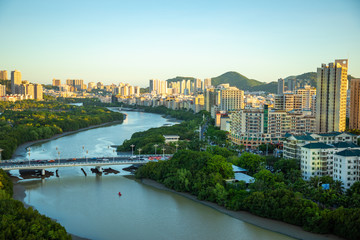 Aerial view of Sanya city with river at sunset light, Hainan province, China