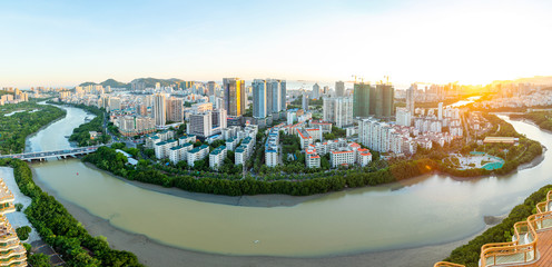 Aerial view of Sanya city with river at sunset light, Hainan province, China