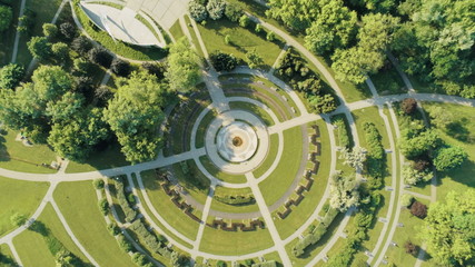 Aerial View of Pole Mokotowskie Park in Warsaw City in Poland, with round structure of sidewalks