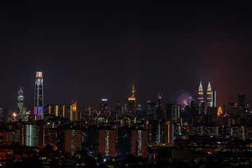Obraz premium KUALA LUMPUR, MALAYSIA - 31st AUGUST 2019; The Kuala Lumpur skyline glittered with a kaleidoscope of colours and spectacular lights and sound to mark the nation’s 62 years of independence of Malaysia.