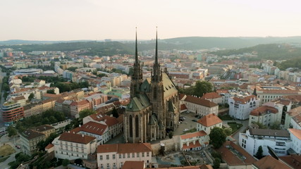 Fototapeta na wymiar Europe, Czech Republic, Brno Cityscape with Landmarks, Cathedral of St. Peter And St. Paul. Aerial View of Old Town with Medieval Gothic Church on Petrov Hill at Sunset