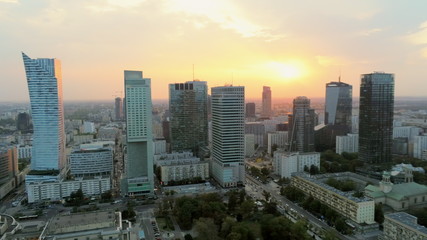Obraz premium Aerial Panoramic View of Warsaw City Centre at Sunset, Poland, Europe. Urban Skyline with Skyscrappers and Car Roads