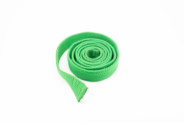 Fototapeta na wymiar green karate belt on white background