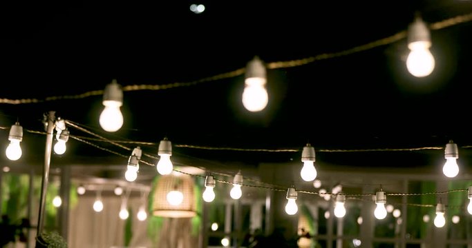 outdoor party string lights glowing at night