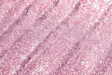 brilliant sand made of metallic glitters with selective focus and small bokeh texture - nice abstract photo background