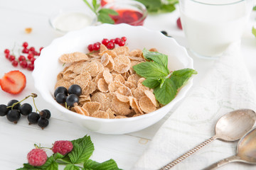 Multigrain wholewheat healthy cereal. Healthy tasty breakfast multigrain wholewheat healthy cereals with strawberries, raspberries, black currants and red currants.