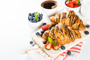 Croissant with chocolate and fresh berries.