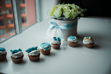flowers on a white table with sweets